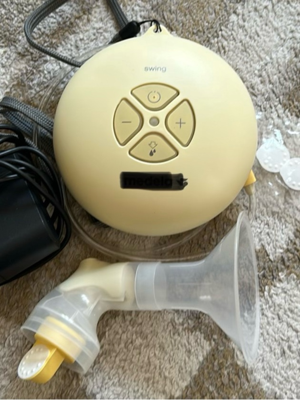 Medela Swing Electric Breast Pump in Light Yellow with Clear Parts
